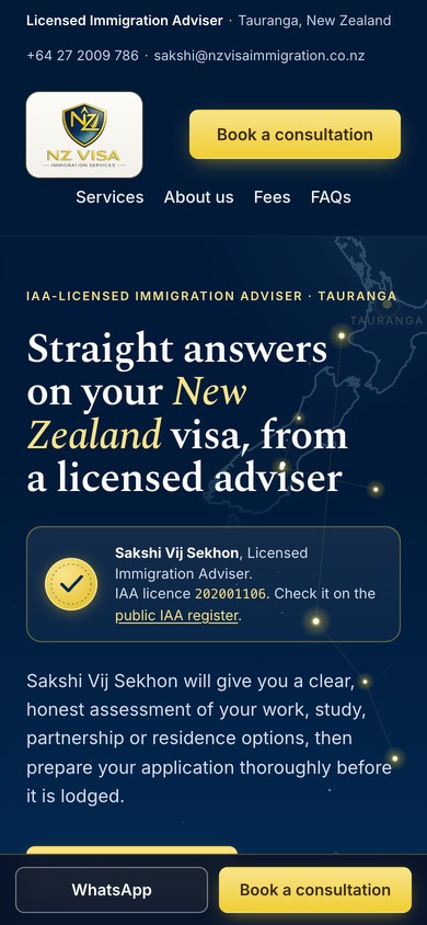 NZ Visa Immigration Services’ home page on a phone, its first screen: the licensed adviser’s headline, then a panel with Sakshi Vij Sekhon’s IAA licence number and a link to the public IAA register, with WhatsApp and Book a consultation fixed along the bottom.